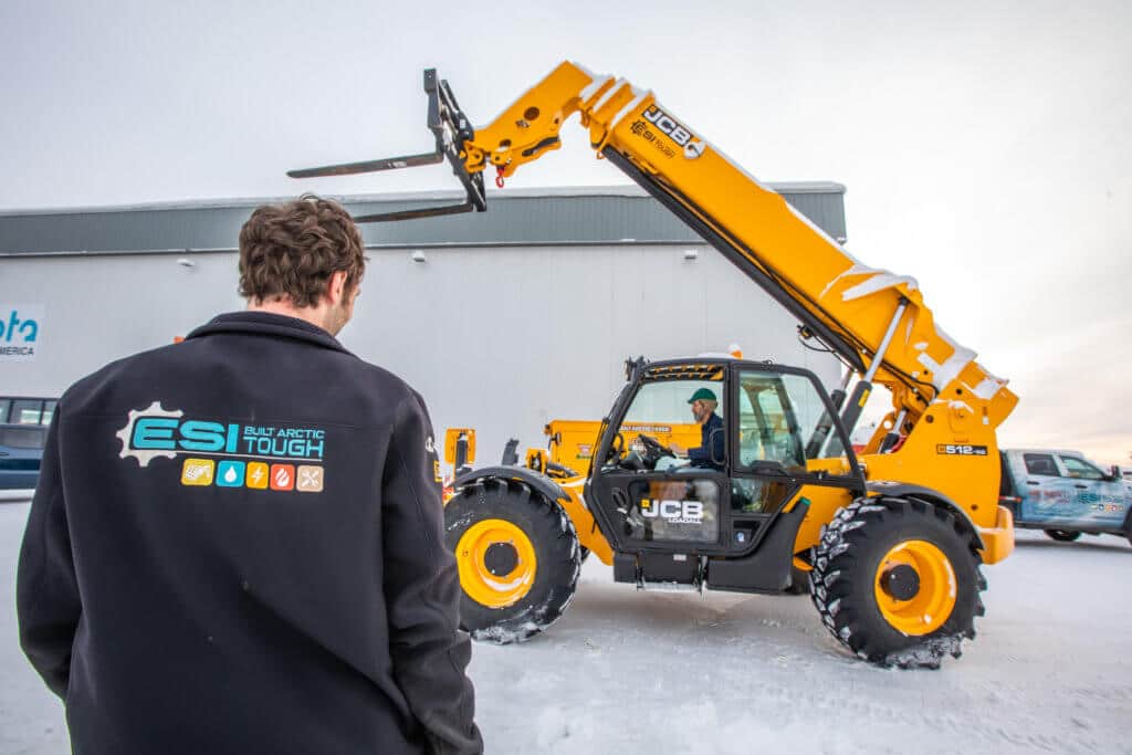 ESI worker looking over specialized construction equipment